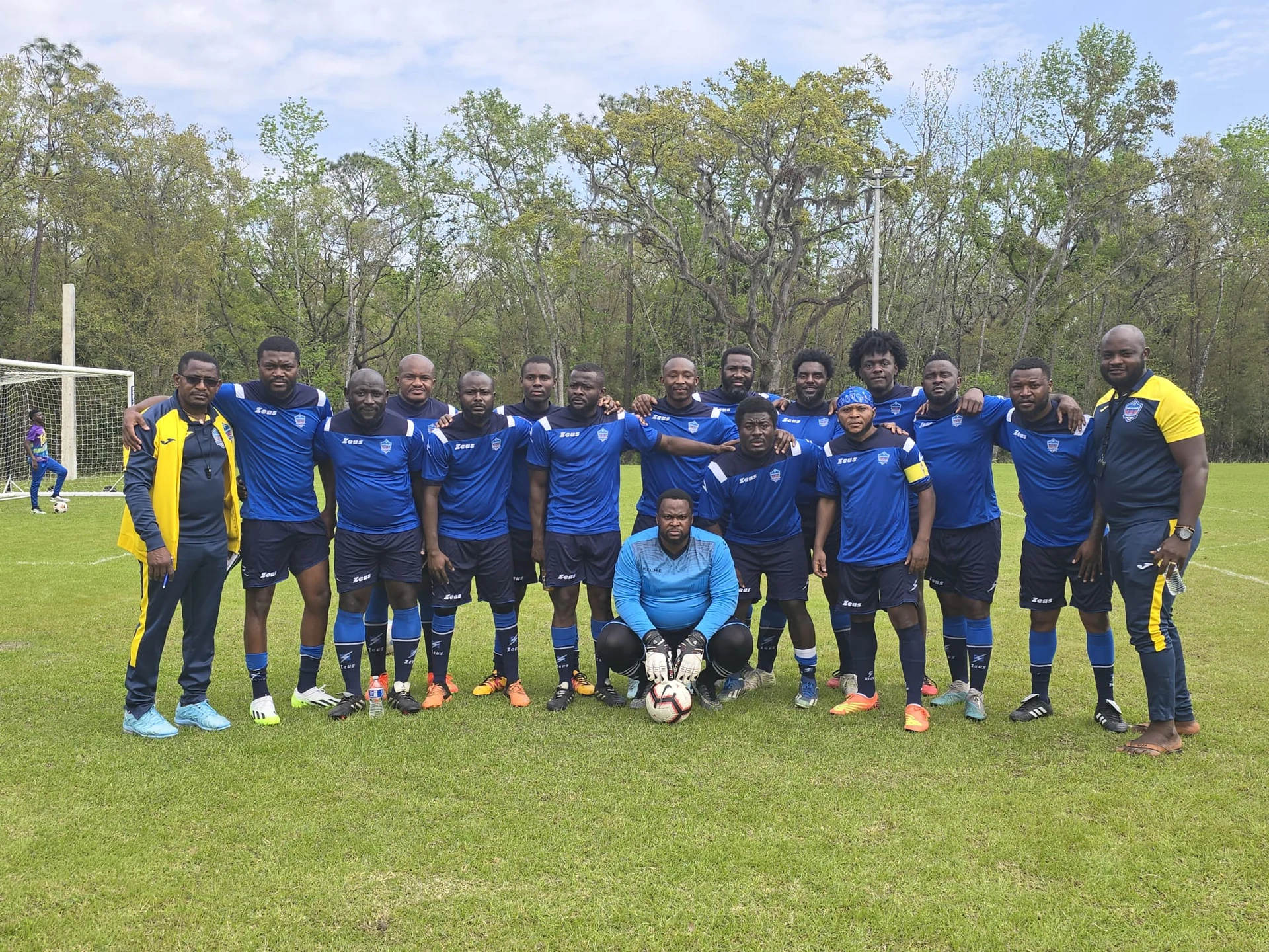 Football team lined up in blue kits