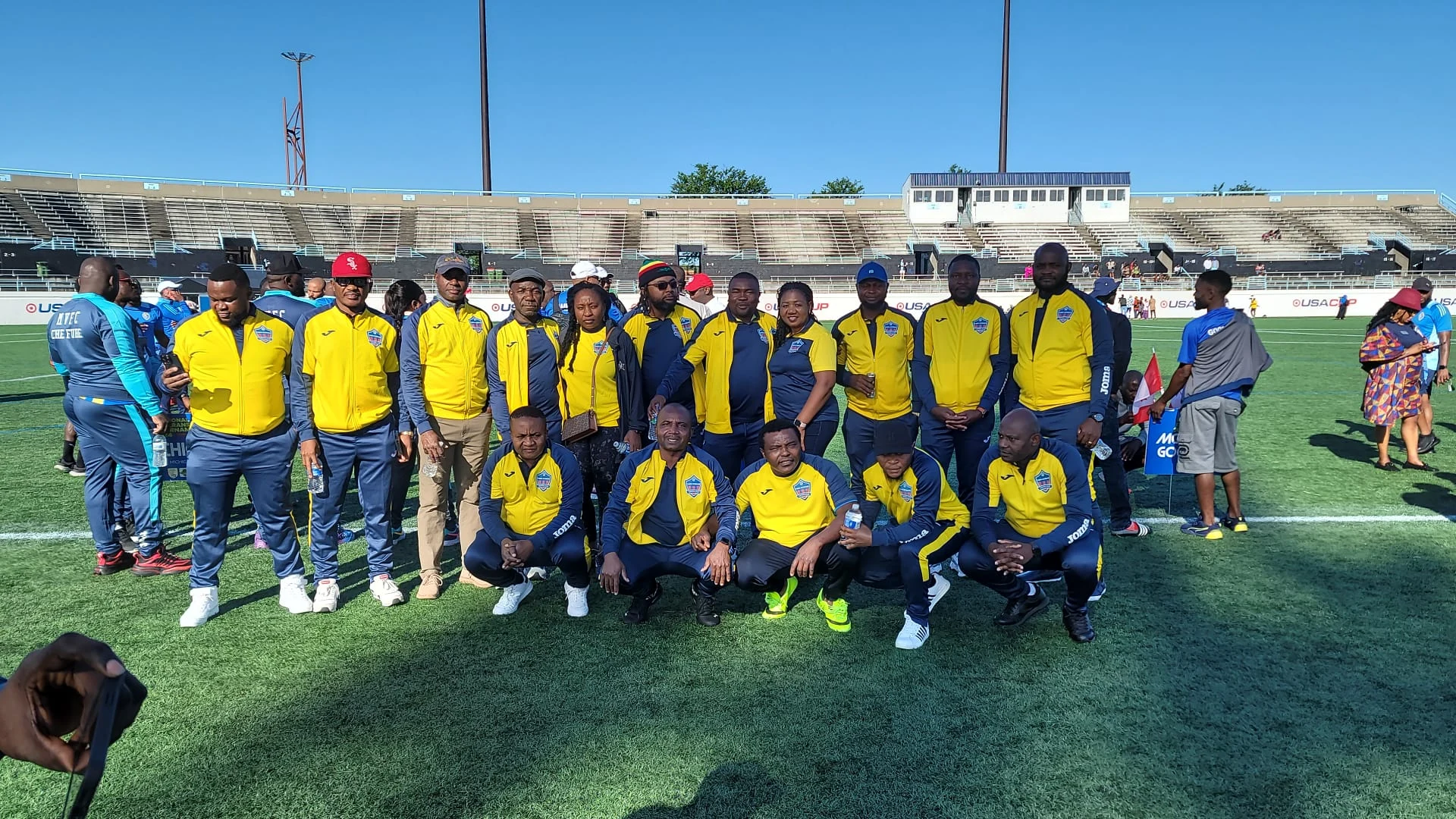 Tampa Veterans players lined up in yellow and navy kits