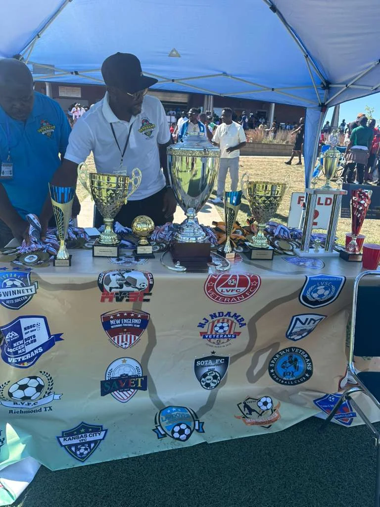 Club trophies and shields displayed beneath a canopy