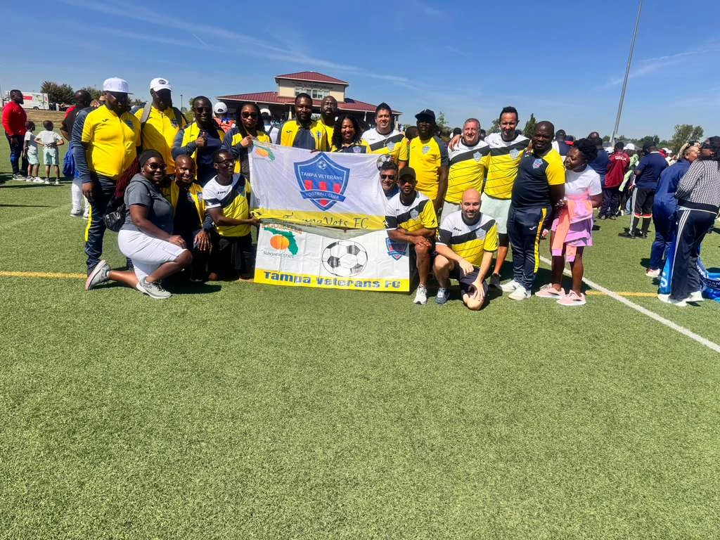 Tampa Veterans members posing with club banners