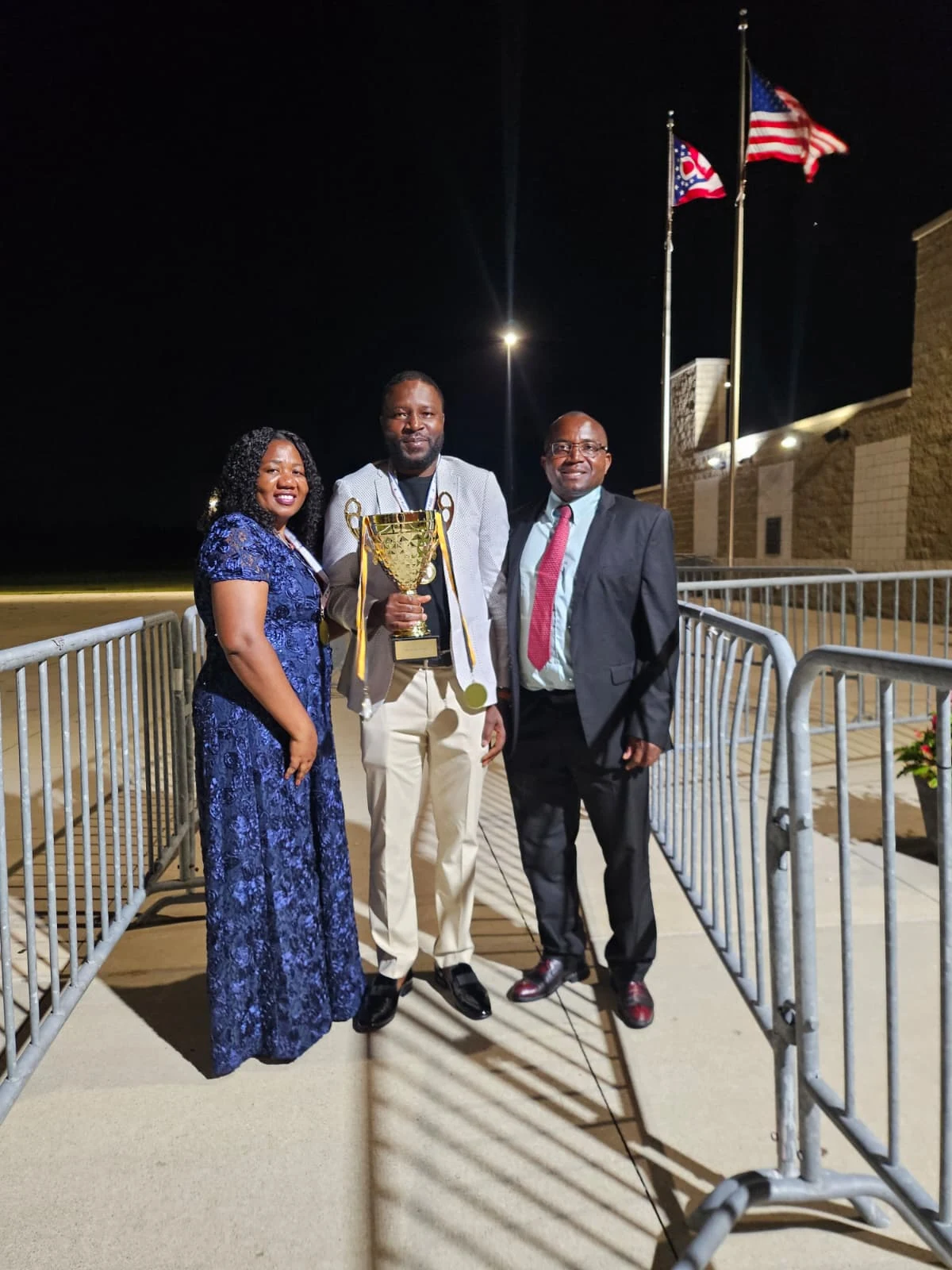 Three guests dressed for an evening celebration